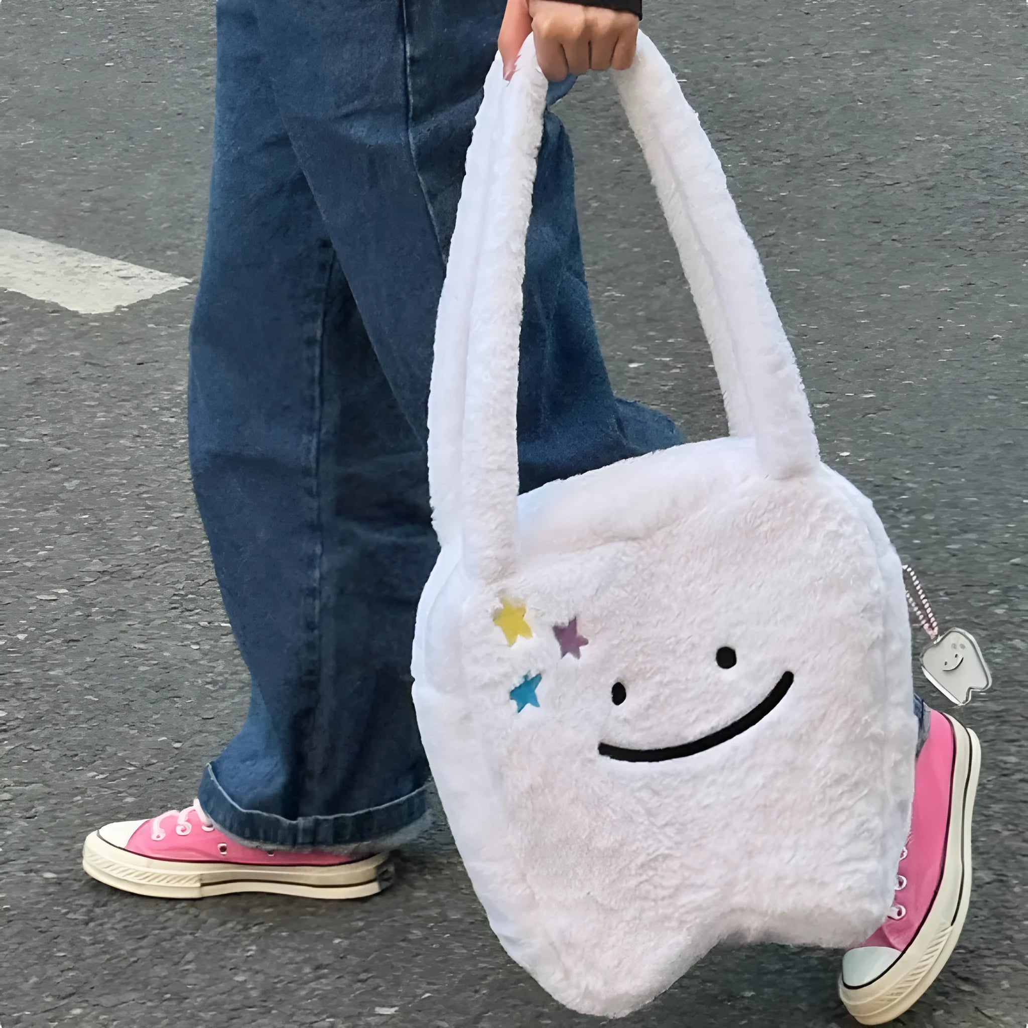 White plush large tooth shoulder tote bag with zip opening shown as crossbody carry