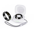 Black ceramic smart ring for health monitoring on a finger, showing charging case.