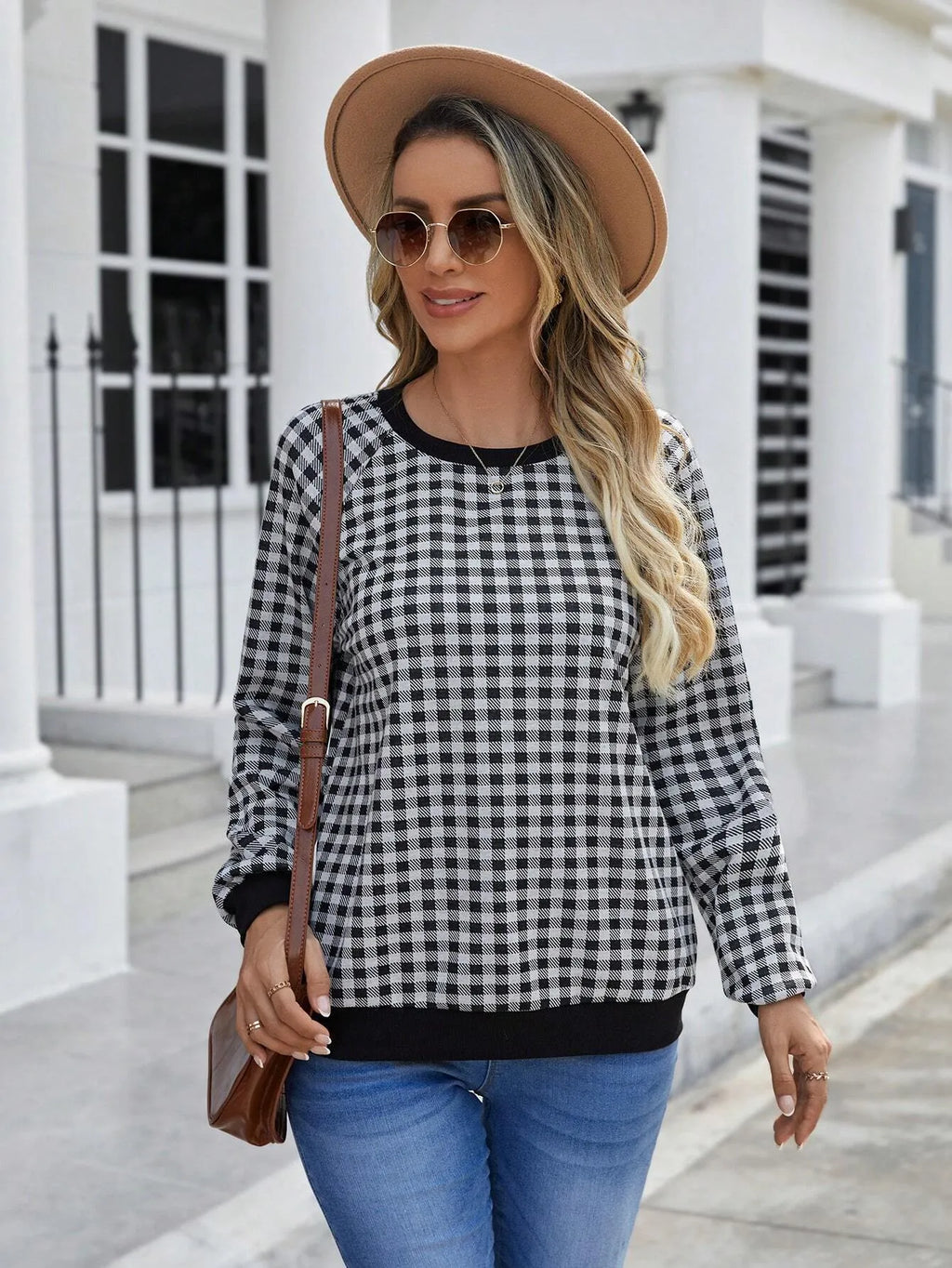 Black long sleeve pullover sweater with a Japanese plaid pattern, shown on a hanger.