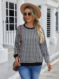 Black long sleeve pullover sweater with a Japanese plaid pattern, shown on a hanger.