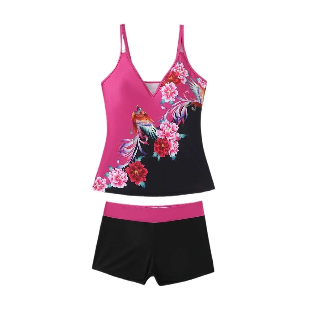 A plus size woman wearing a black two-piece printed swimsuit at the beach.