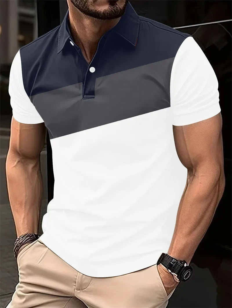 Man modelling a loose-fit grey T-shirt with a colourful 3D digital print pattern on the front.