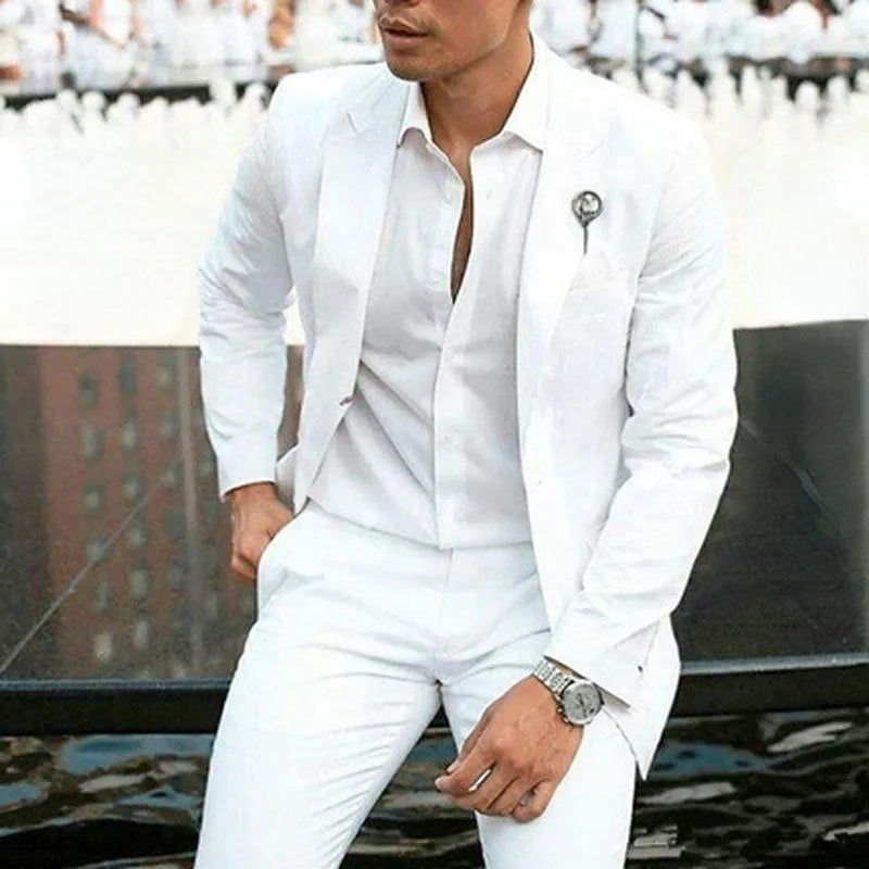 Men's white two-piece slim fit suit jacket and trousers for weddings.