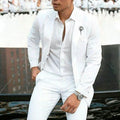 Men's white two-piece slim fit suit jacket and trousers for weddings.