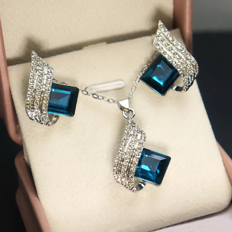 Women's electroplated necklace and earring set with alloy pendant and glass accents