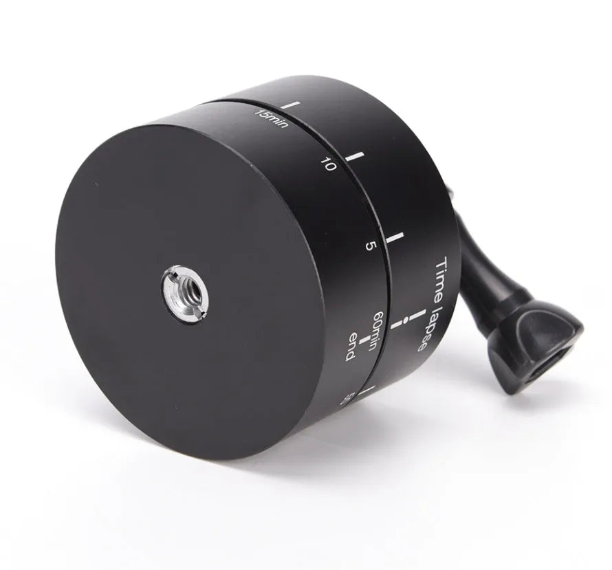 Lapse-compatible rotating tripod head base for automated camera panning on a video tripod.