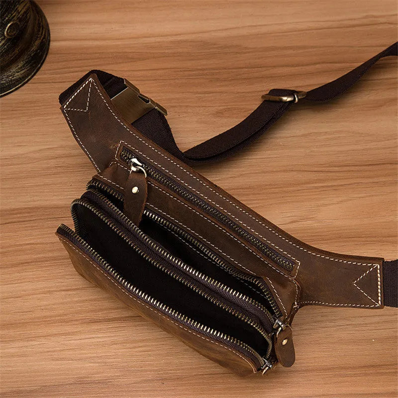 Brown top layer cowhide men's sports waist bag with pull closure, showing size and interior phone pocket.