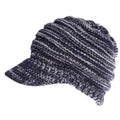 Woman wearing a soft knitted beanie with a ponytail pulled through the opening in the crown.