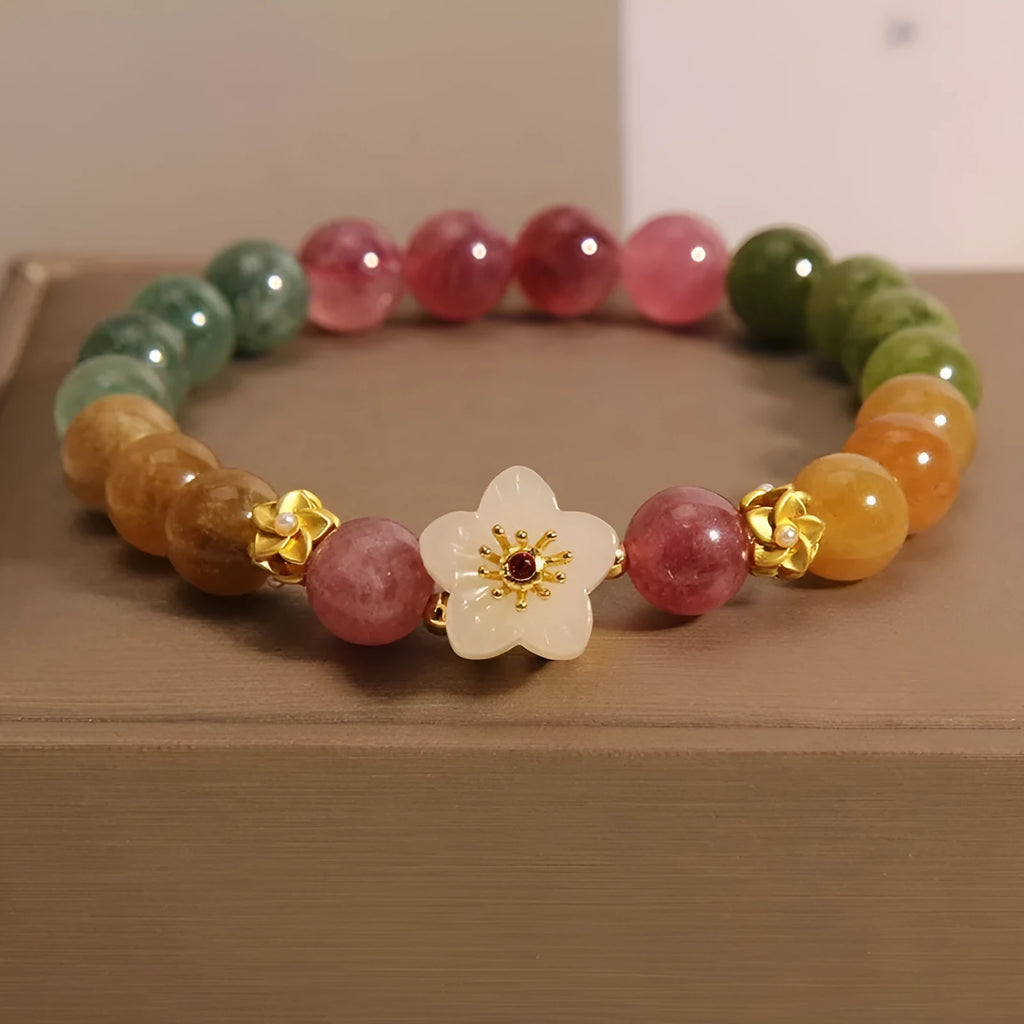 Natural colour tourmaline bracelet with floral and fu character designs and electroplated finish