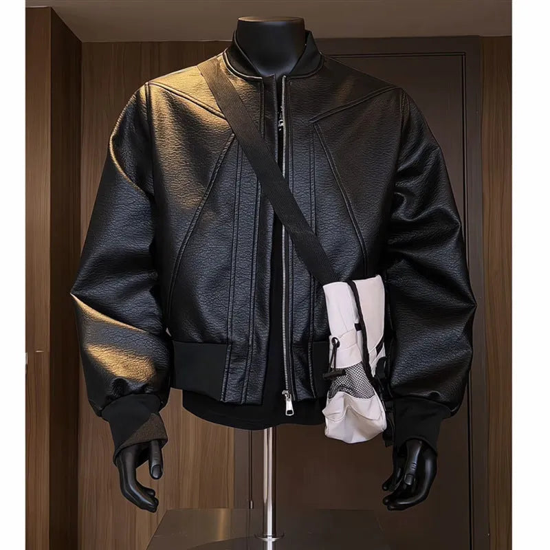 Men's black extended length PU leather jacket with litchi grain texture, shown in a tight business fit.