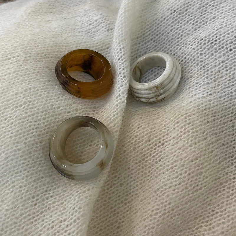 Geometric irregular resin ring in free size, shown in Maillard brown colour.
