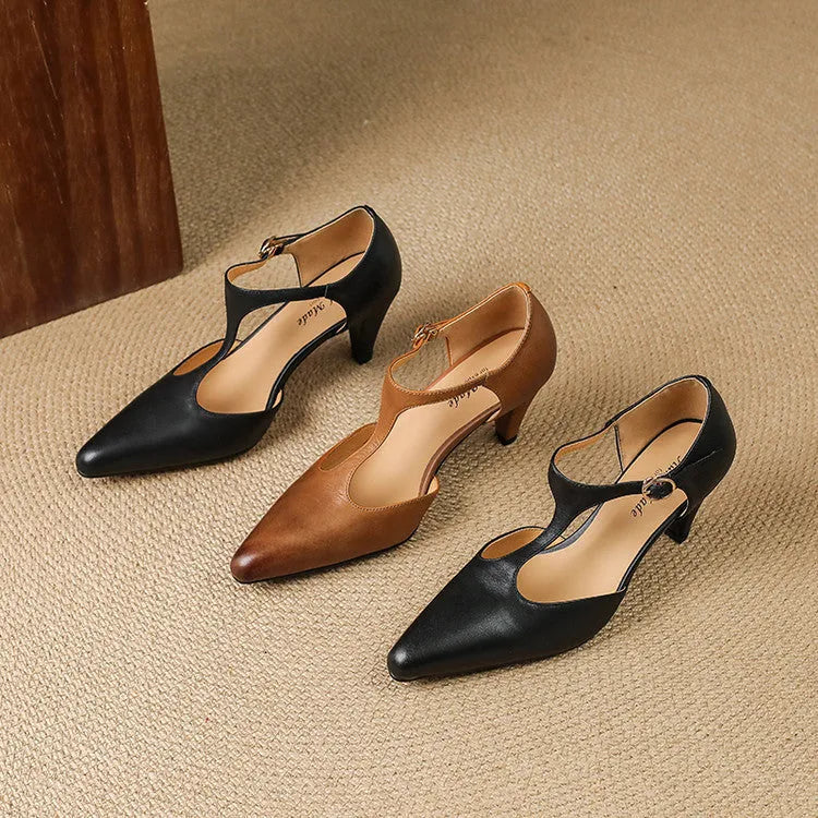Brown women's retro T-strap closed toe sandals with a chunky high heel on a white background.