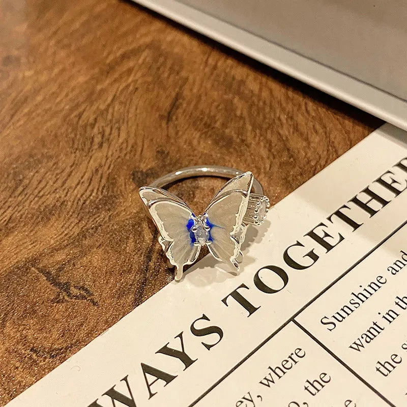 Butterfly women's copper ring with adjustable split ring design showing oil-drip colour treatment
