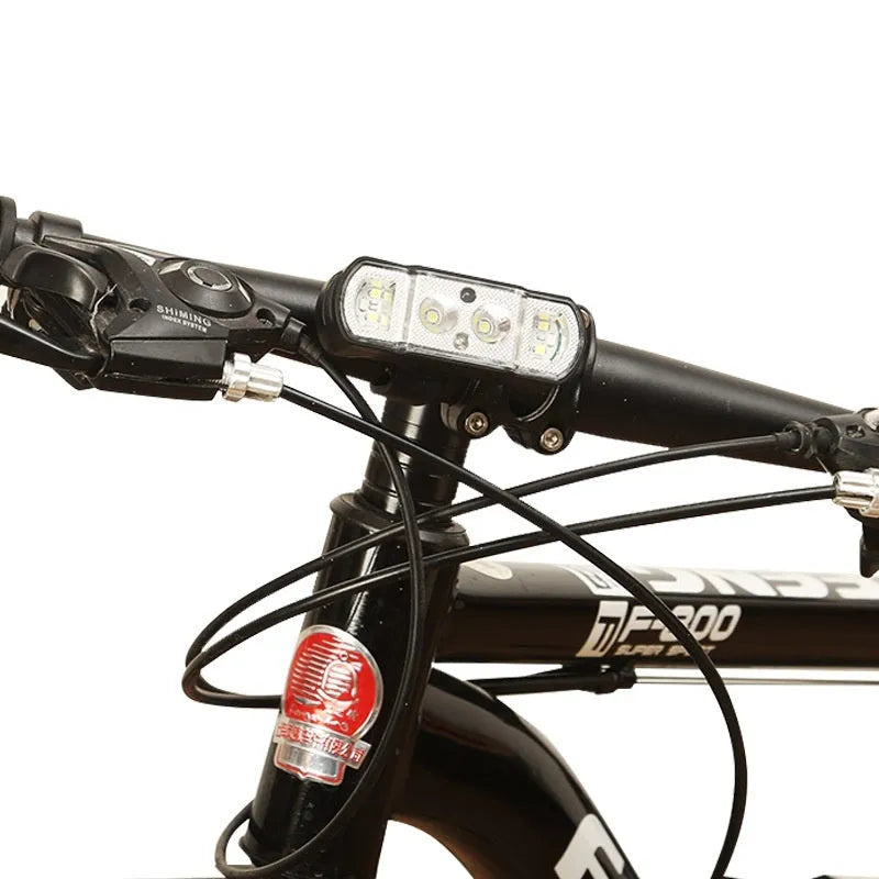 Black bicycle headlight with 350 lumen LED, rechargeable battery, and wave induction controls