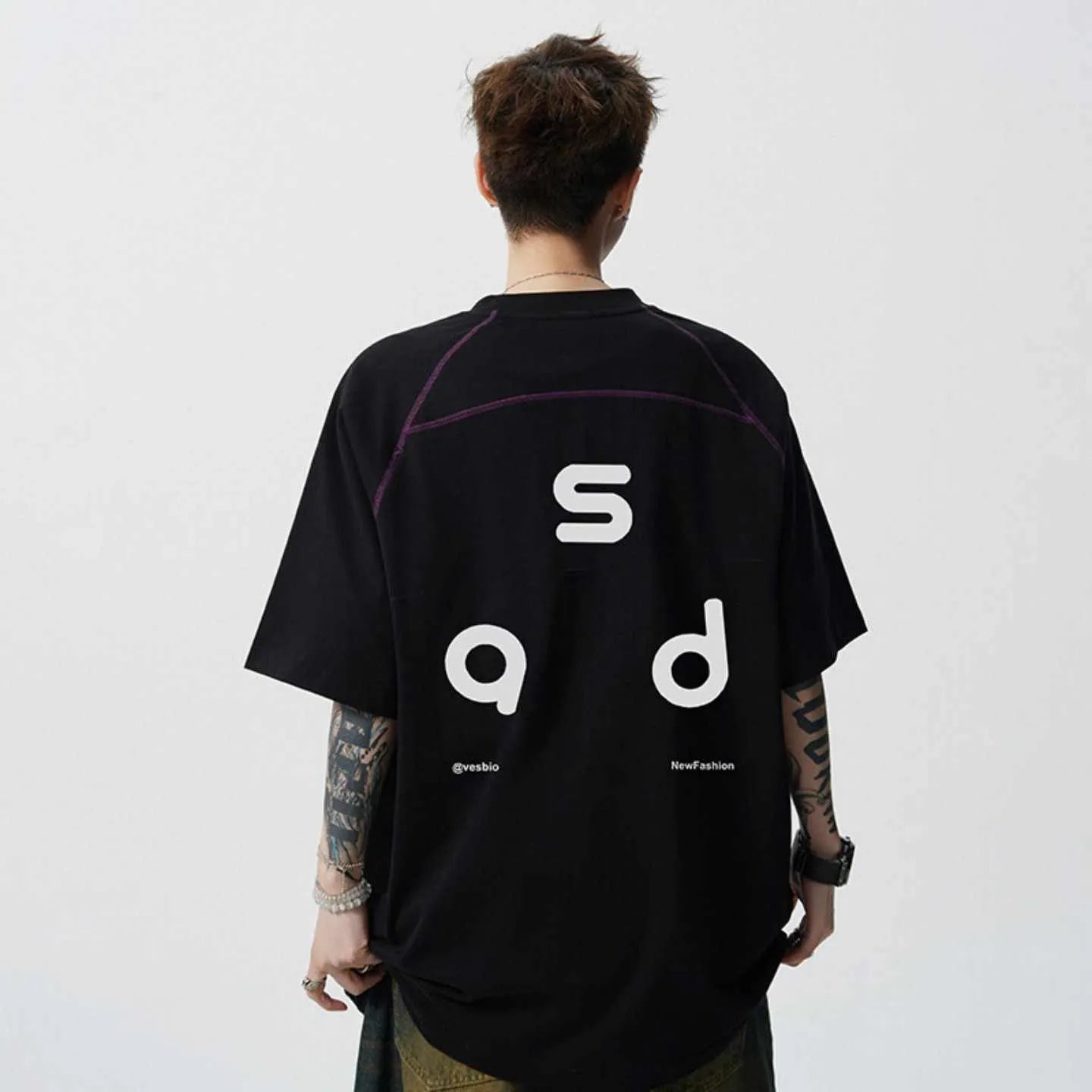 Men's loose fit cotton short-sleeve T-shirt with a printed letter design, shown in available colours.