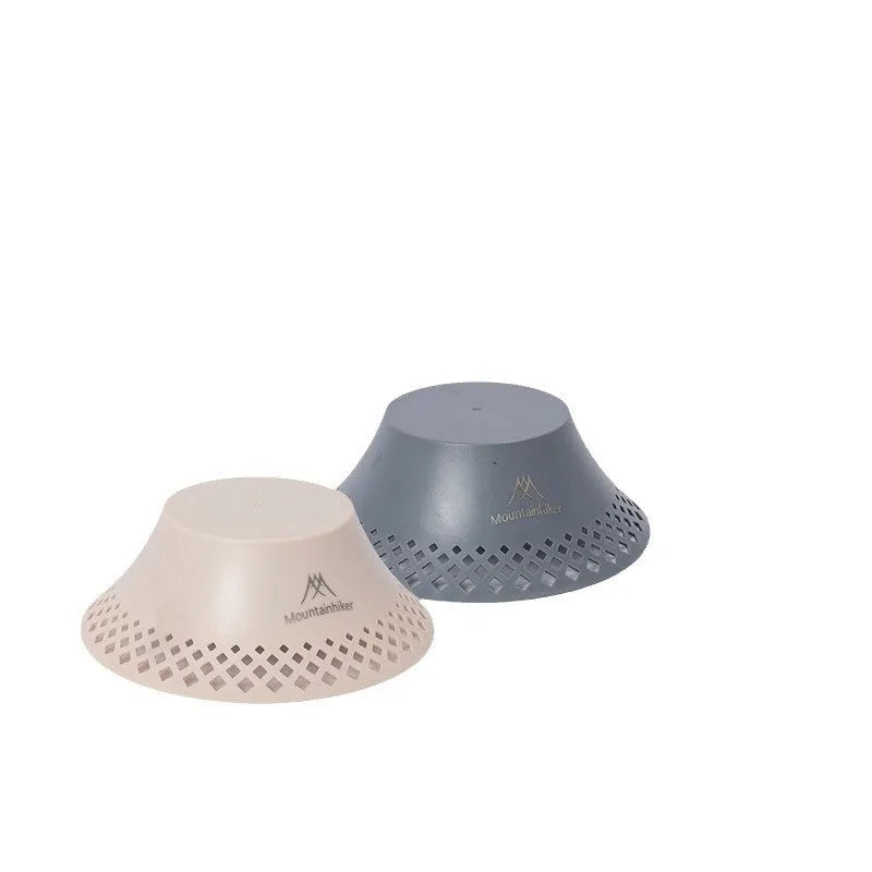 Beige and grey camping lantern with wine bottle-shaped shade showing USB-C port and light modes.