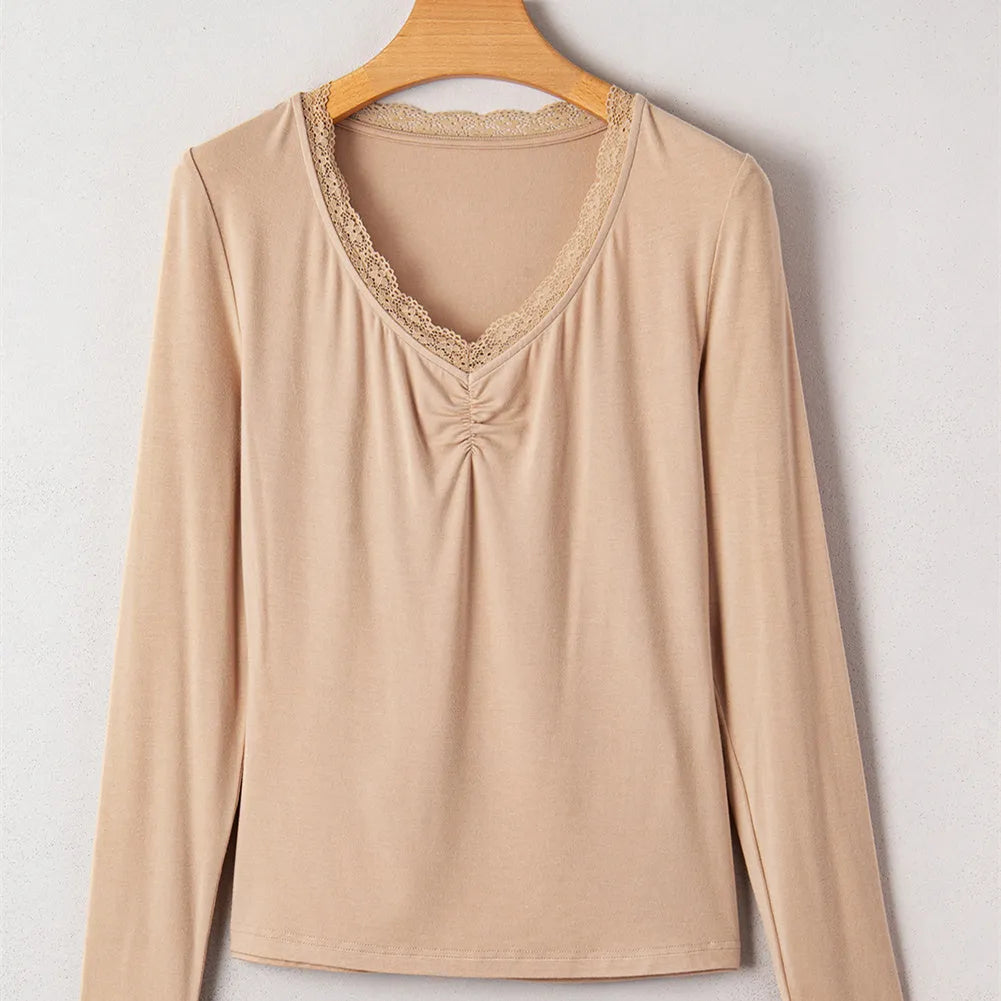 Red slim fit long sleeve casual top with lace trim on a hanger.
