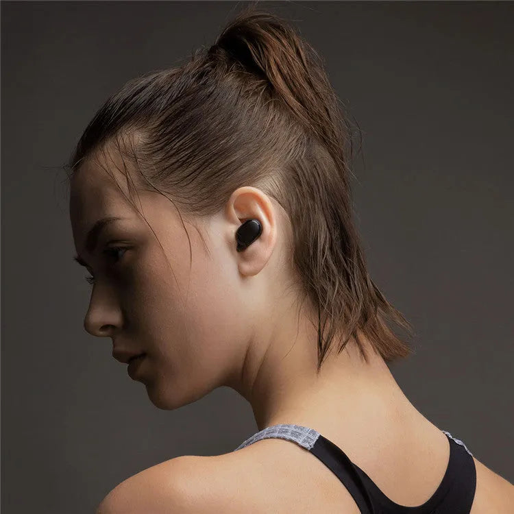 Redmi AirDots 2 black true wireless earbuds with charging case on a white background.