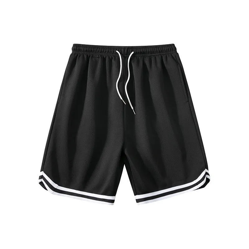 Man wearing loose grey sports shorts made from polyester fabric, showcasing the fit and style.