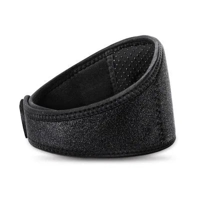 Black self-heating magnetic therapy neck guard with adjustable straps on a flat surface.