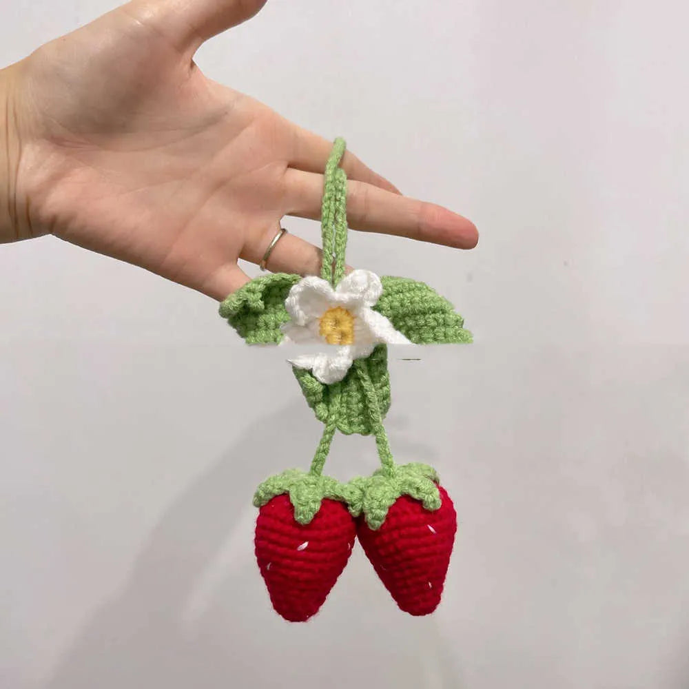 Handmade strawberry-shaped car pendant made from knitted cotton and hemp wool.