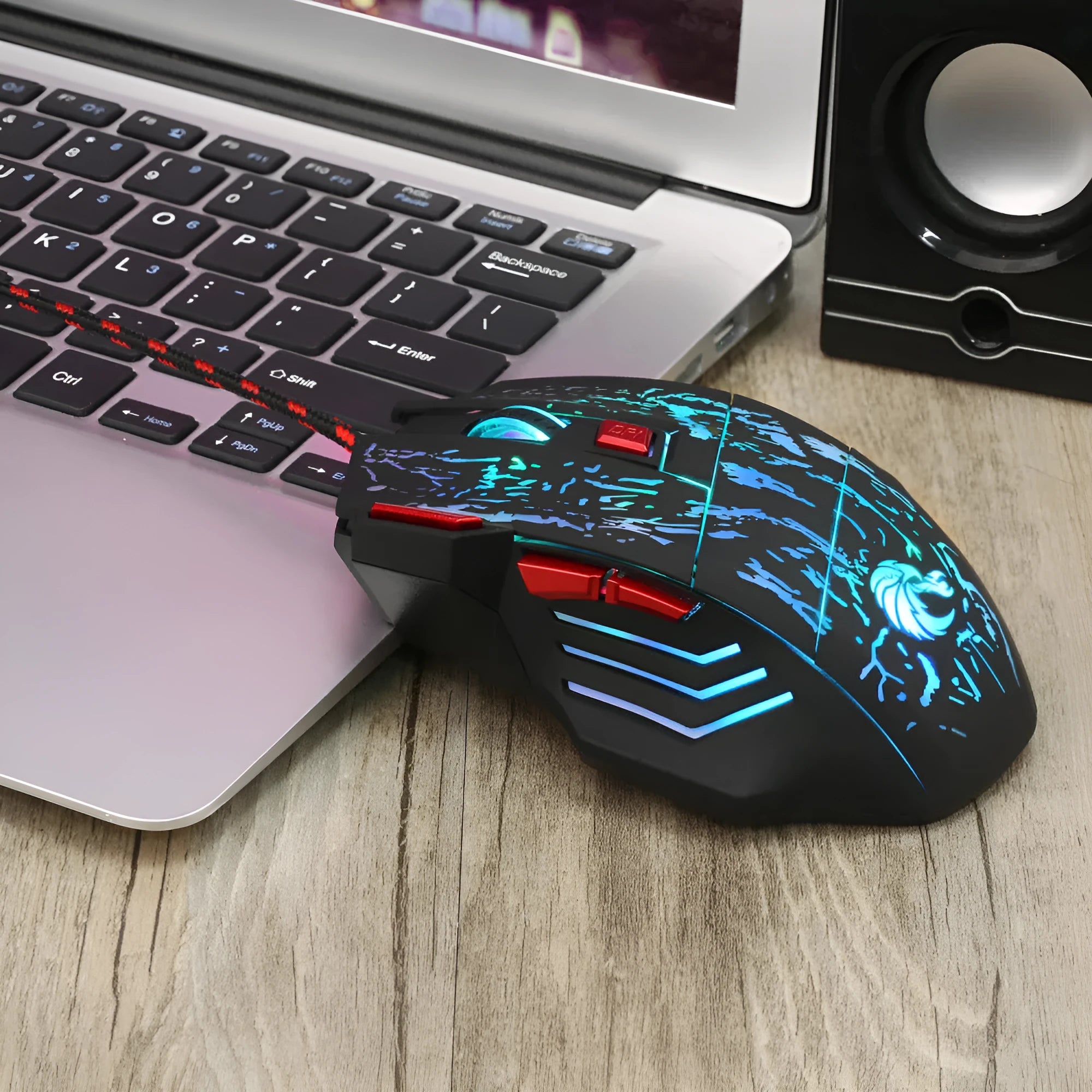 H300BK colour wired gaming mouse with luminous lighting effects on desktop