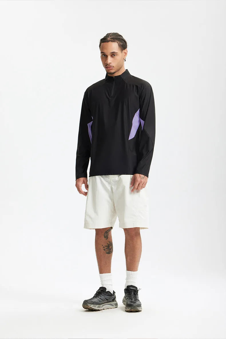 Men's lightweight solid colour polyester top in black, available in short sleeve and long sleeve styles.