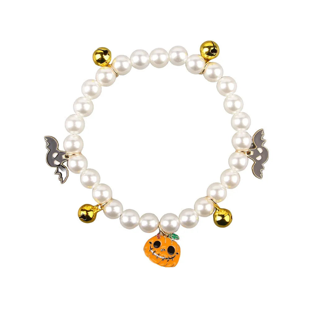 Halloween pet collar decoration with simulated pearl beads and a pumpkin charm.