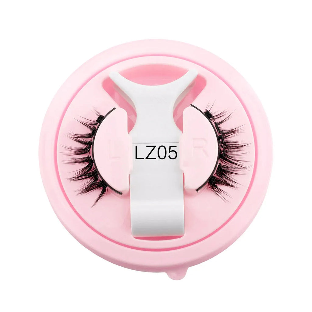Set of reusable waterproof false eyelashes with thick artificial fibre strands and a flexible glue-free band.