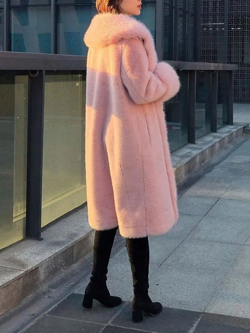 Grey women's mid-length faux rabbit fur coat with a fur collar, shown on a hanger.
