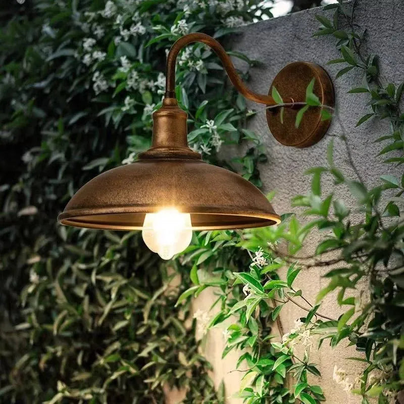 Retro-style outdoor wall lamp for a villa courtyard, shown in copper and silver finish options.