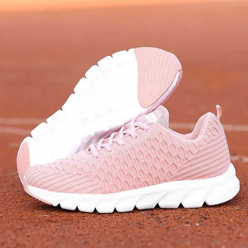 Women's running shoes with Fly Knit woven upper in Black, Pink, or White colour options
