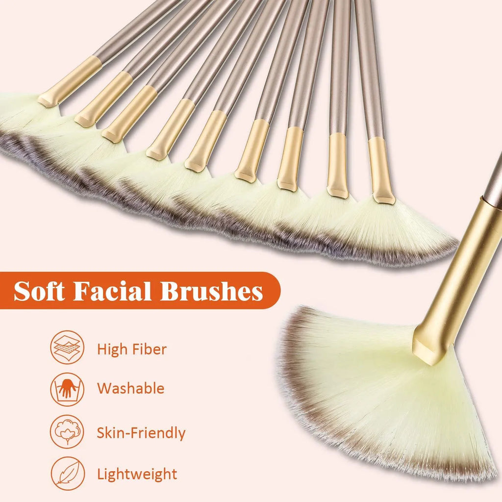 Set of 10 professional facial fan brushes with champagne finish and acrylic handles on a table.