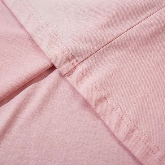 Women's loose cotton pullover top with drop-shoulder sleeves in dark grey or pink with letter print