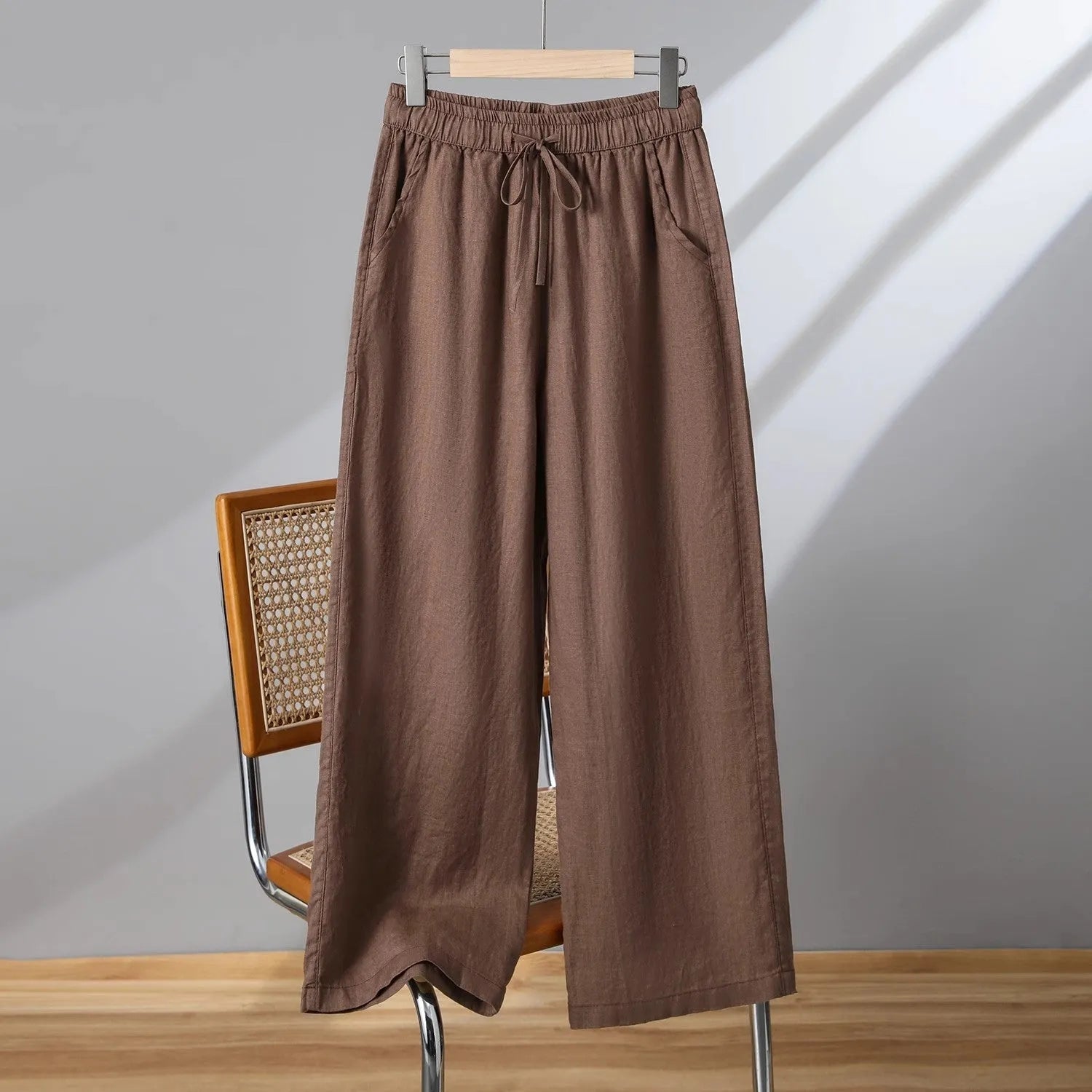 Women's straight-leg casual trousers with an elastic drawstring waist, shown in apricot colour.