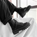 Black men's platform Dr Martens ankle boots with side zipper and 8-hole design