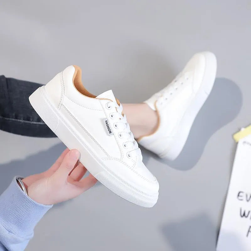 Women's low top Korean style sneakers in white or brown artificial PU leather with plastic sole.