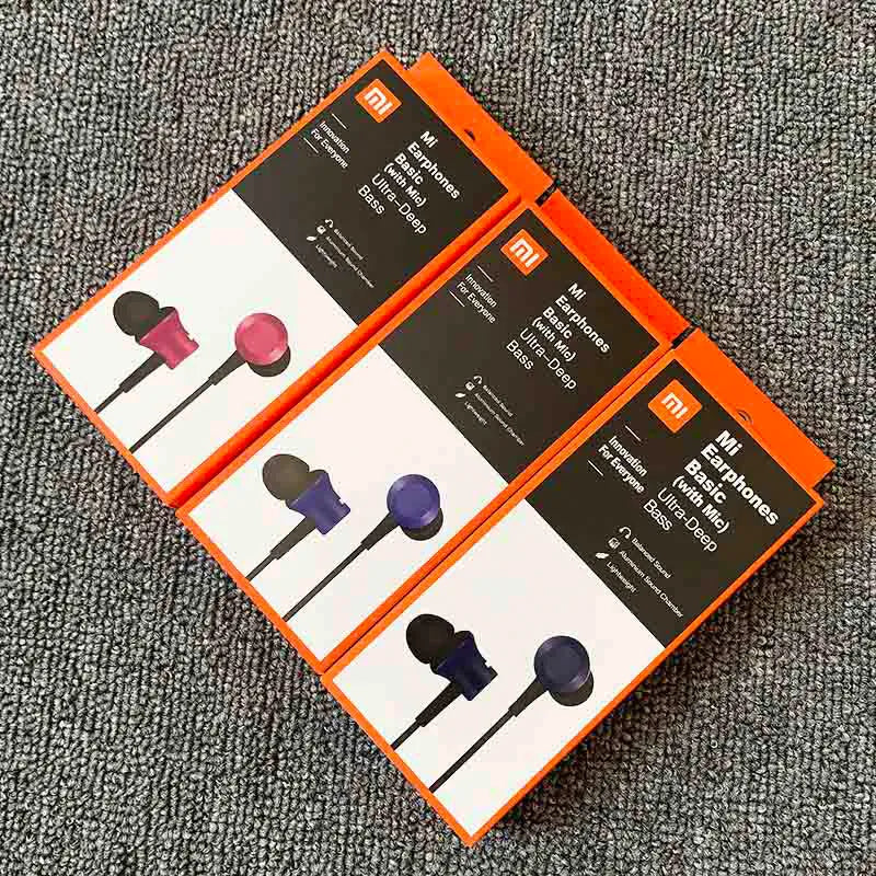 Piston-style wired in-ear headphones with a 3.5mm plug, shown in black, blue and red colour options.