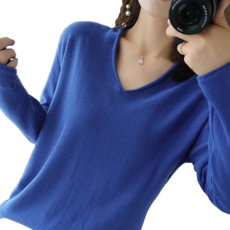 Women's V-neck long sleeve knitwear top in wine red colour, laid flat.