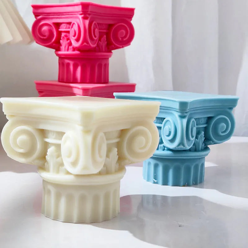 A flexible silicone mould in the shape of an irregular Roman pillar for making candles, chocolate, and crafts.