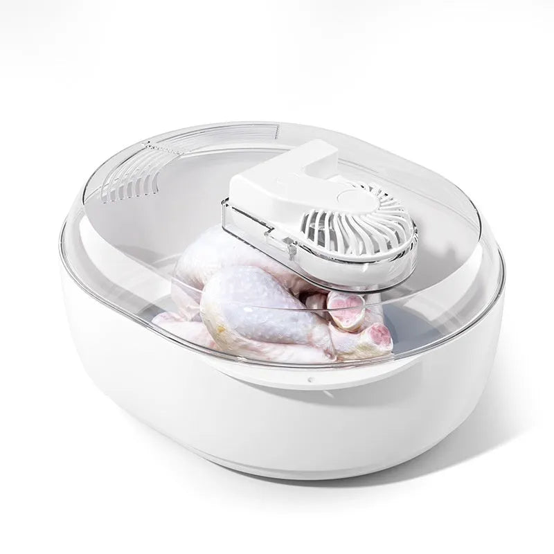 A modern aluminium household defrosting plate with a USB cable on a kitchen worktop.
