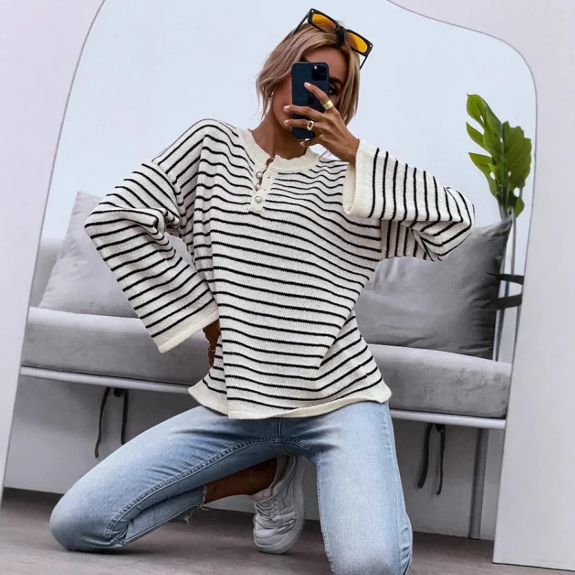 Black striped women's long sleeve top with drop shoulder design and button front