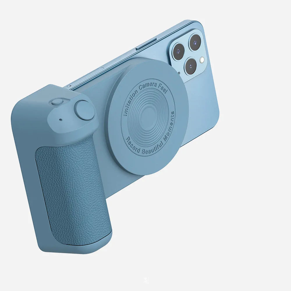 Black magnetic phone camera bracket with PU leather grip and adjustable tilt stand on a table