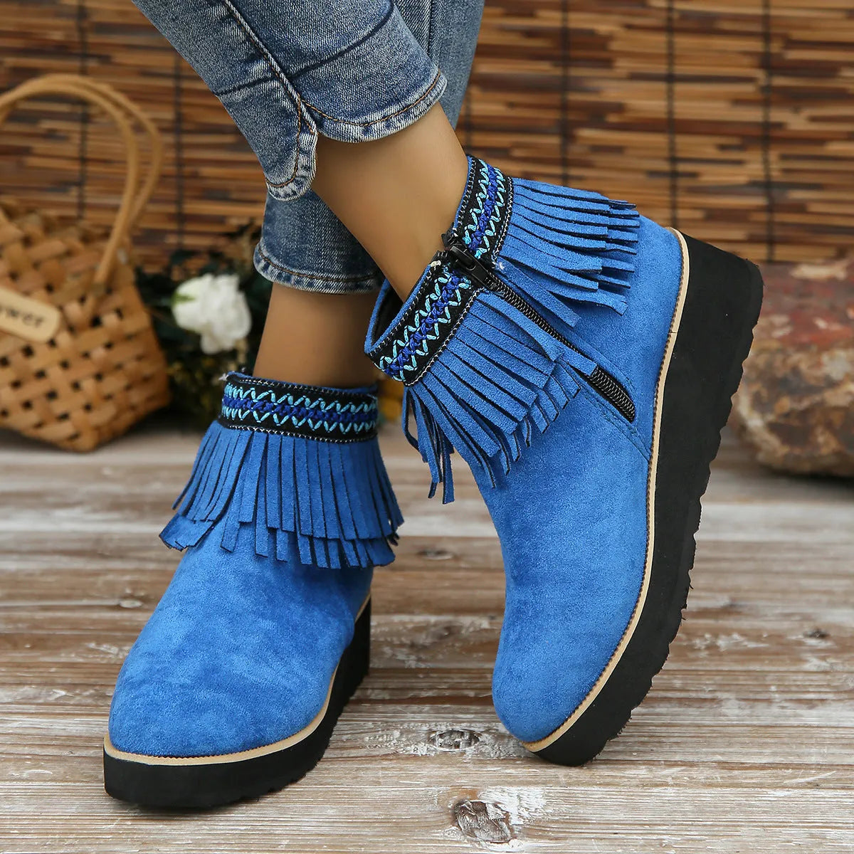 Women's black suede wedge ankle boots with a thick platform sole and side zipper.