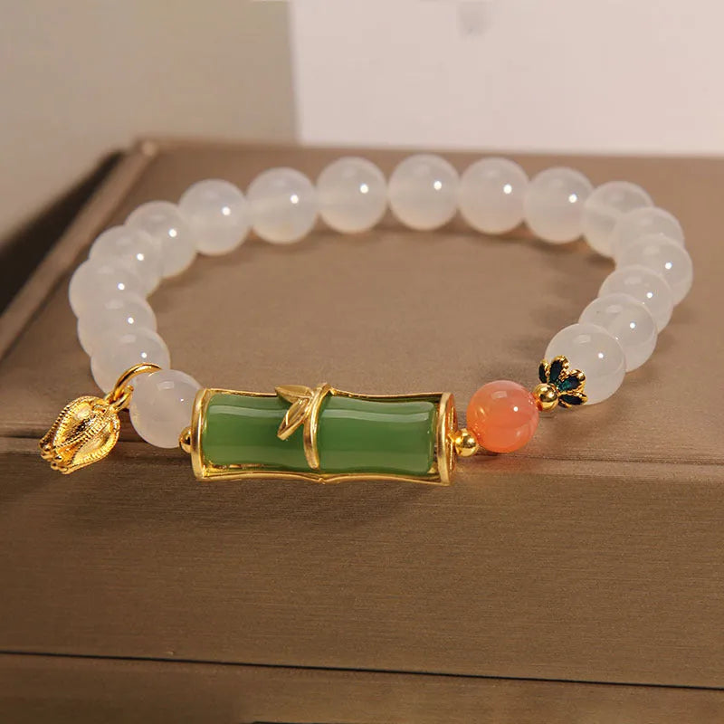 Women's white agate jade bracelet with bamboo joint beads in a retro Chinese style.