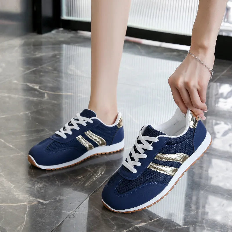 Blue women's casual tennis shoes with cross shoulder straps and white rubber sole