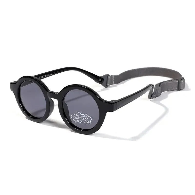 Soft silicone round-frame sunglasses for babies and toddlers aged 0-3 years with polarised UV400 lenses.