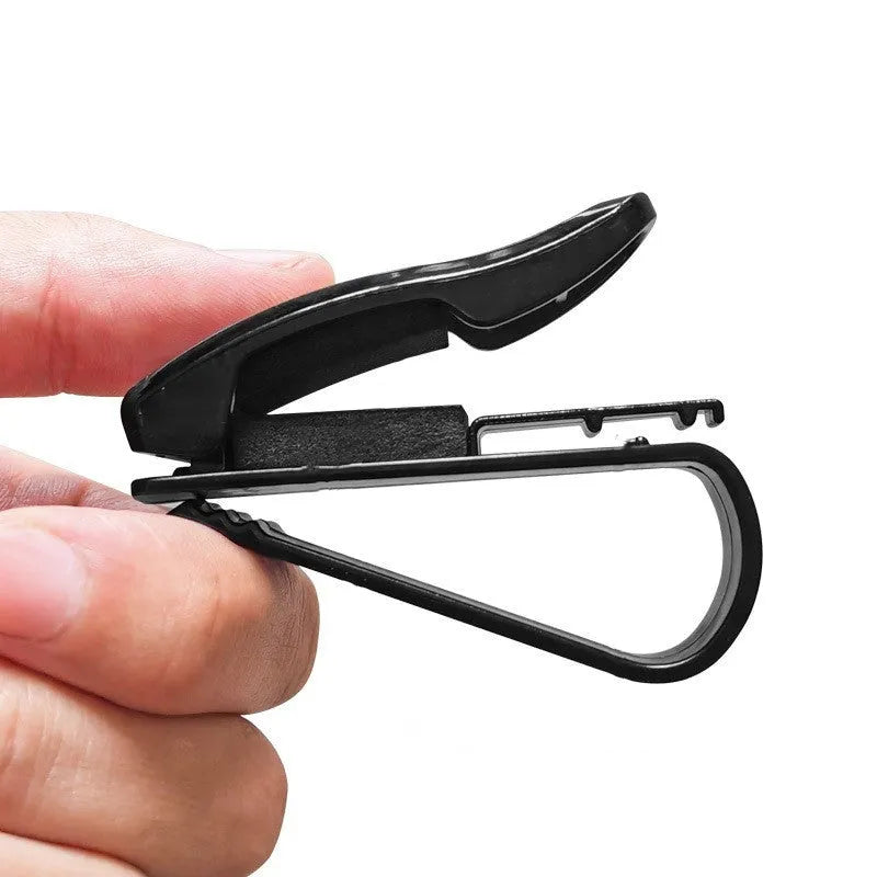 Black plastic car sunshade clip for holding glasses, tickets and ID cards, dimensions 6.5 by 2.3 centimetres