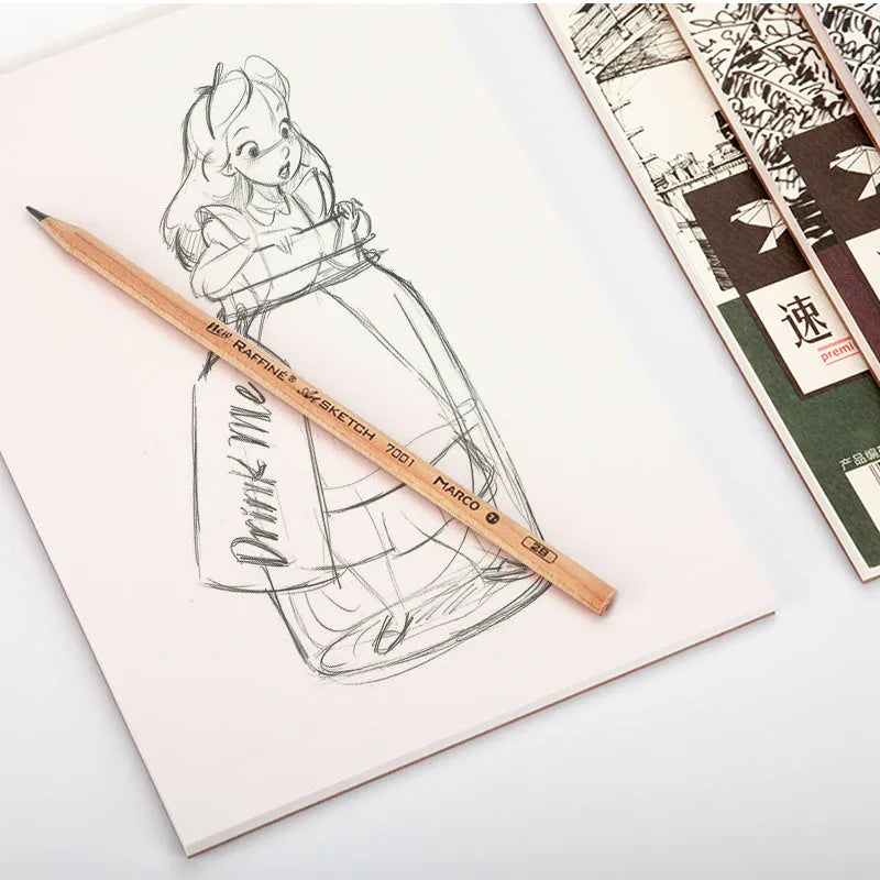 A4 sketch book with spiral coil binding lying open on a table, showing blank heavyweight paper.