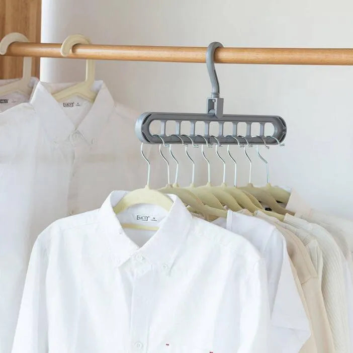 Plastic clothes hanger with 360-degree rotating hook in pink or green, measuring 33cm long